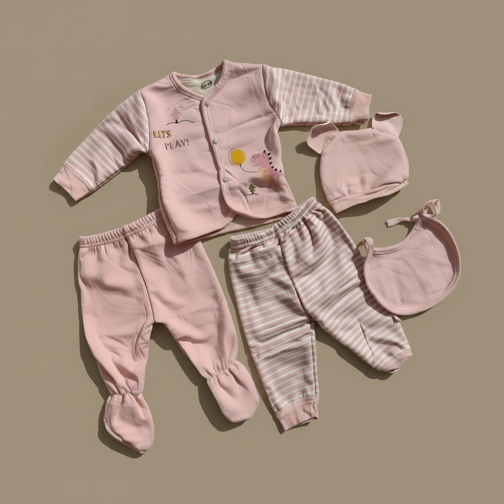 Pink baby outfit set with top, pants, and hat on a beige background