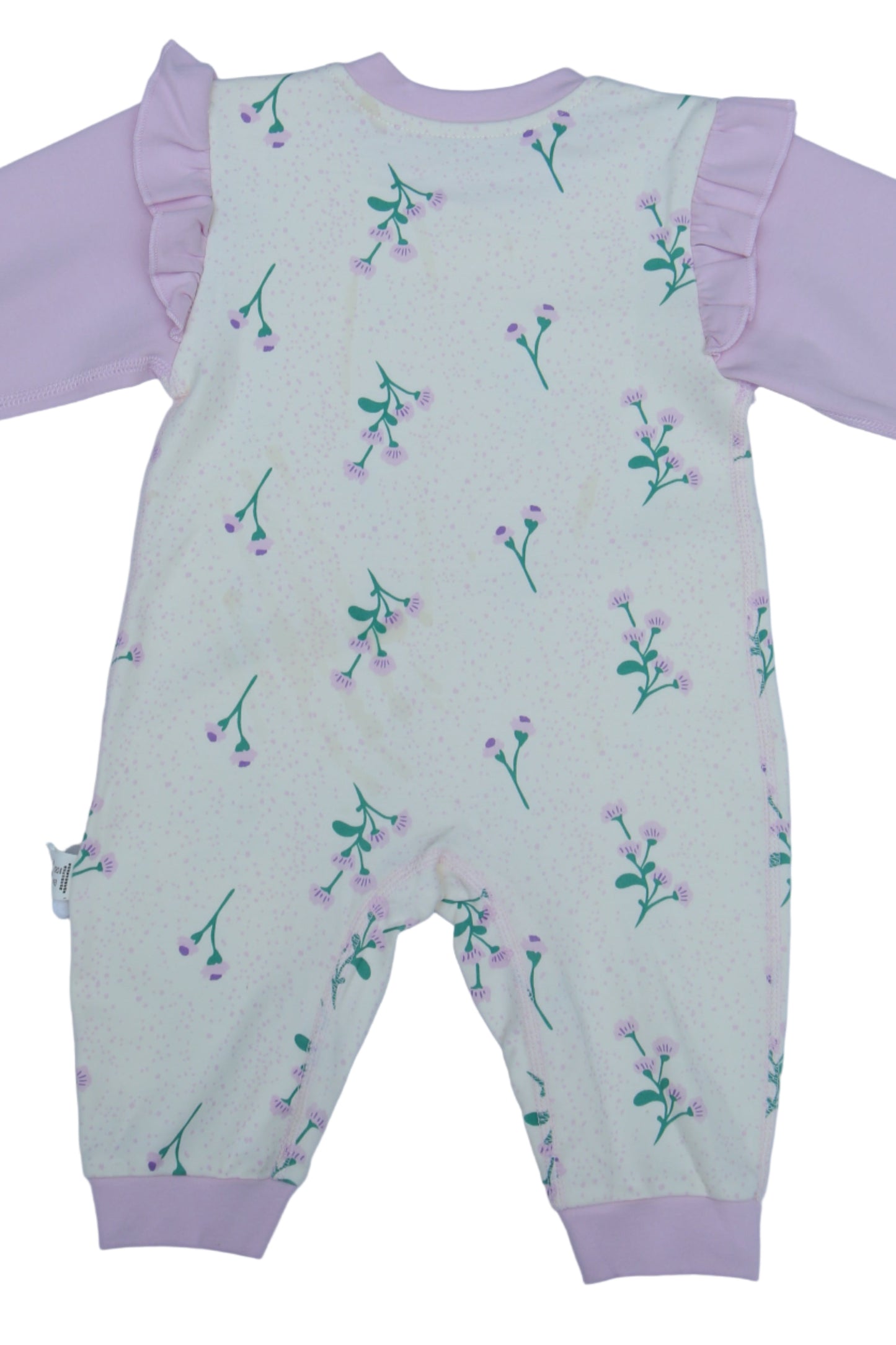 Children's outfit with pink pants and patterned top on a white background