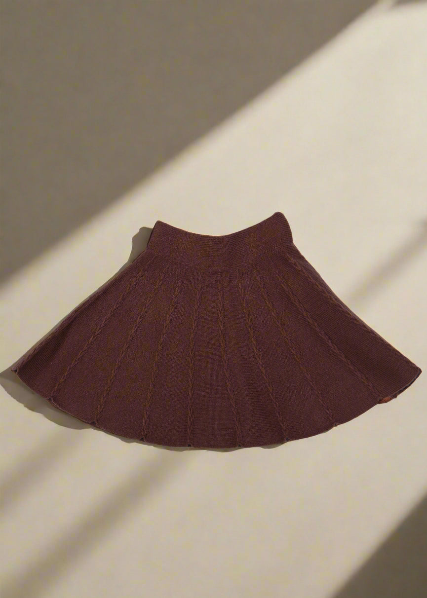 Brown knit fabric on a white background