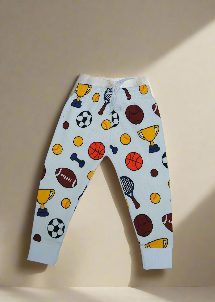Pair of white leggings with sports-themed pattern on a light blue background