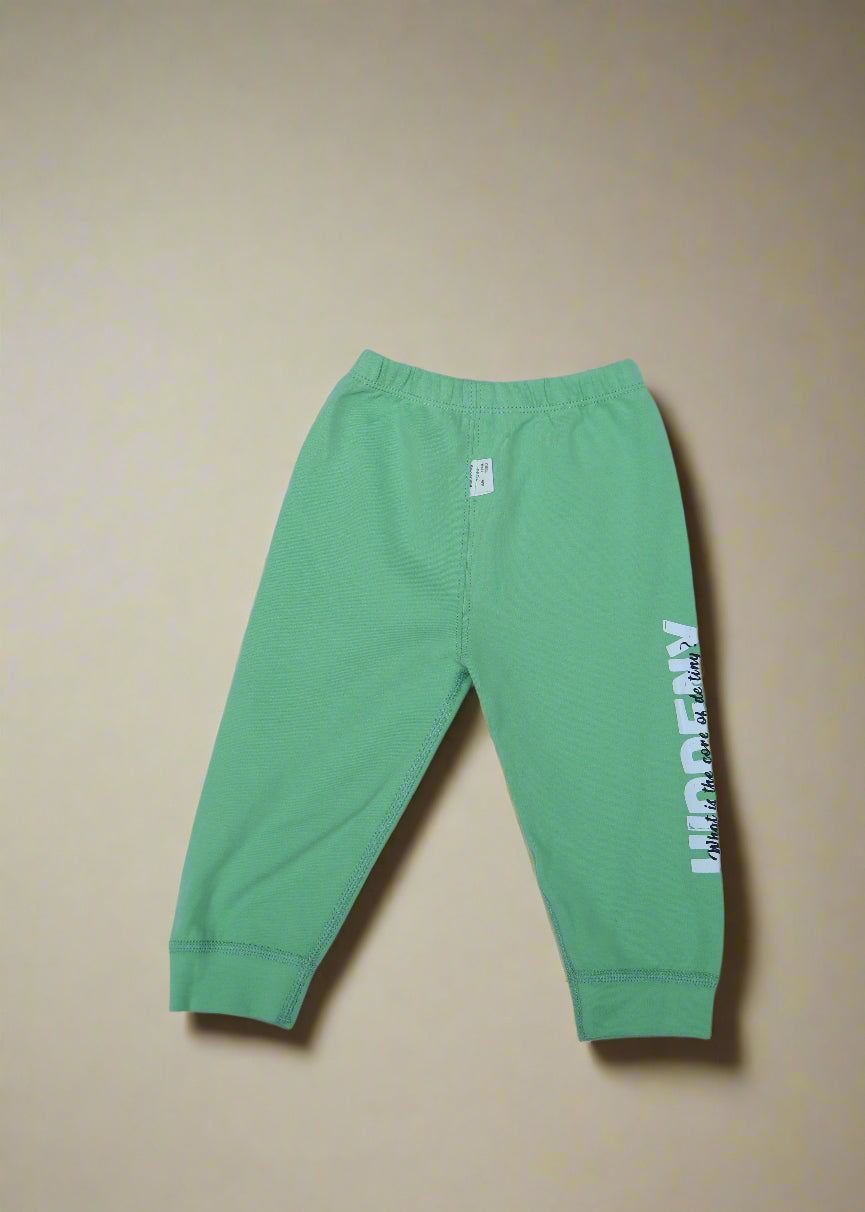Green pants with text on a light blue background