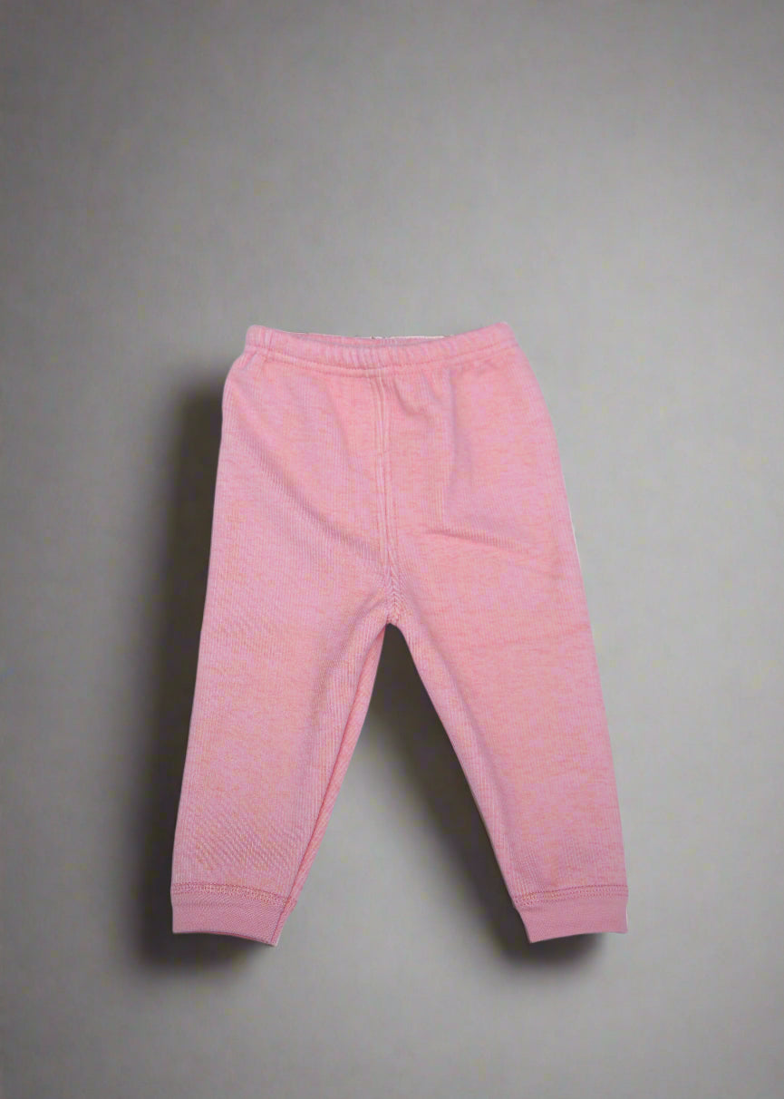 Pink baby pants on a light blue background