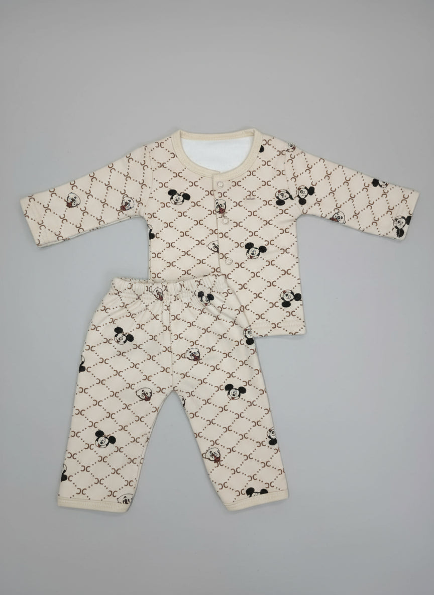 Children's pajama set with pattern on a tiled floor
