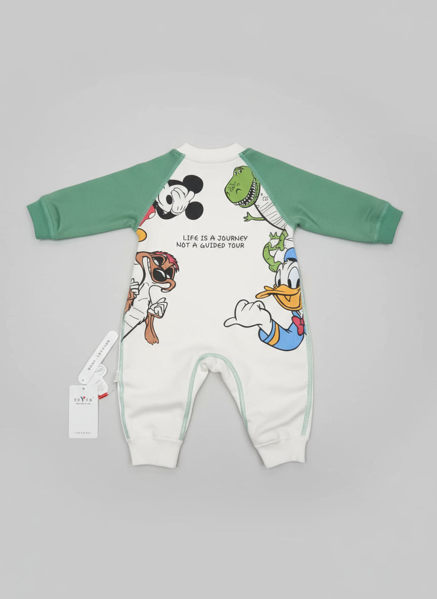 Children's onesie with cartoon characters and text on a tiled floor