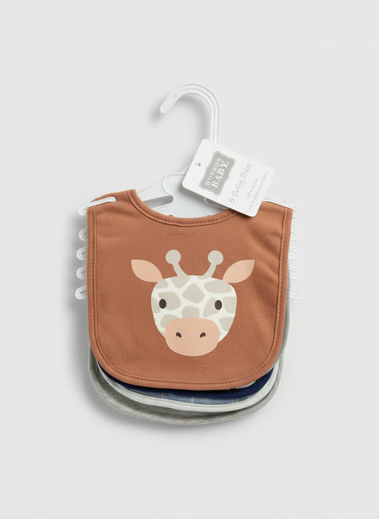 Brown bib with giraffe design on a hanger against a textured surface