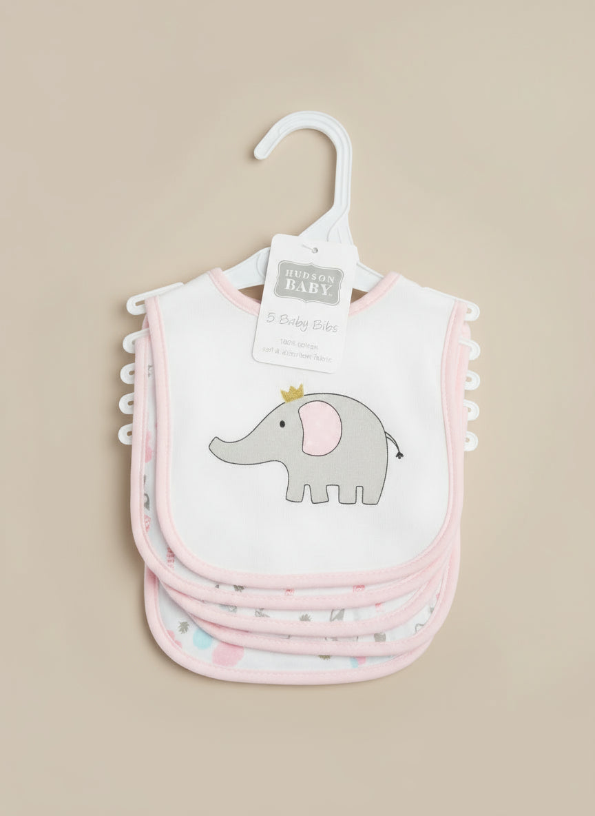 Set of baby bibs with an elephant design on a hanger against a textured surface