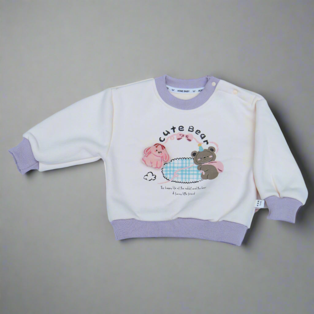 Children's outfit with cartoon design on a light blue background