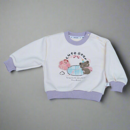 Children's outfit with cartoon design on a light blue background