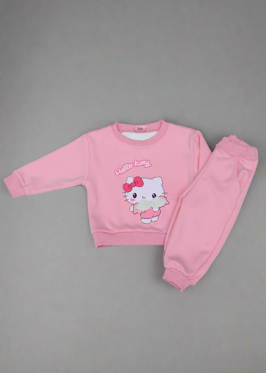 Pink children's outfit with cartoon character on a light  background