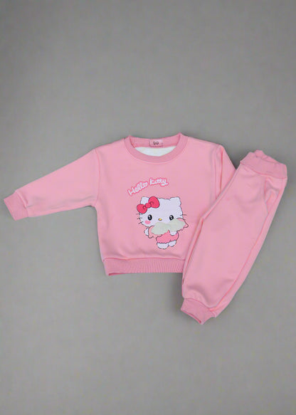 Pink children's outfit with cartoon character on a light  background