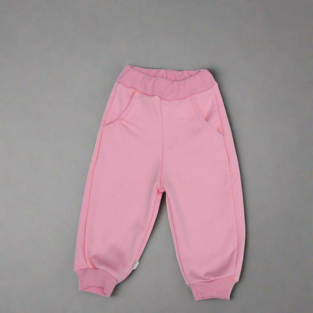 Pink baby pants on a light background
