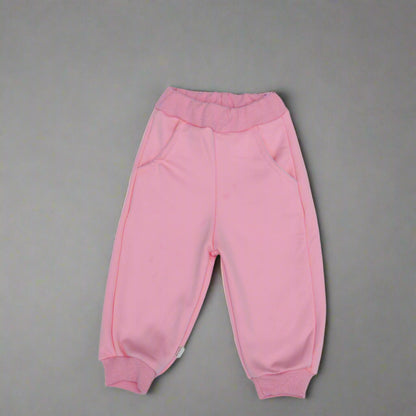 Pink baby pants on a light background