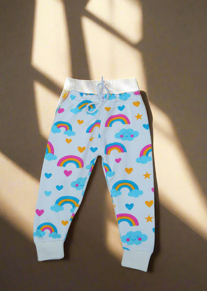 Colorful rainbow and cloud patterned leggings on a light background