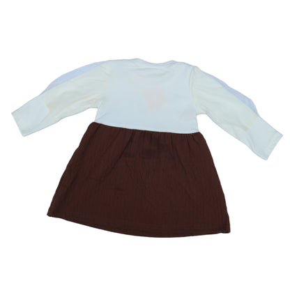 Brown and white fabric swatches on a light  background