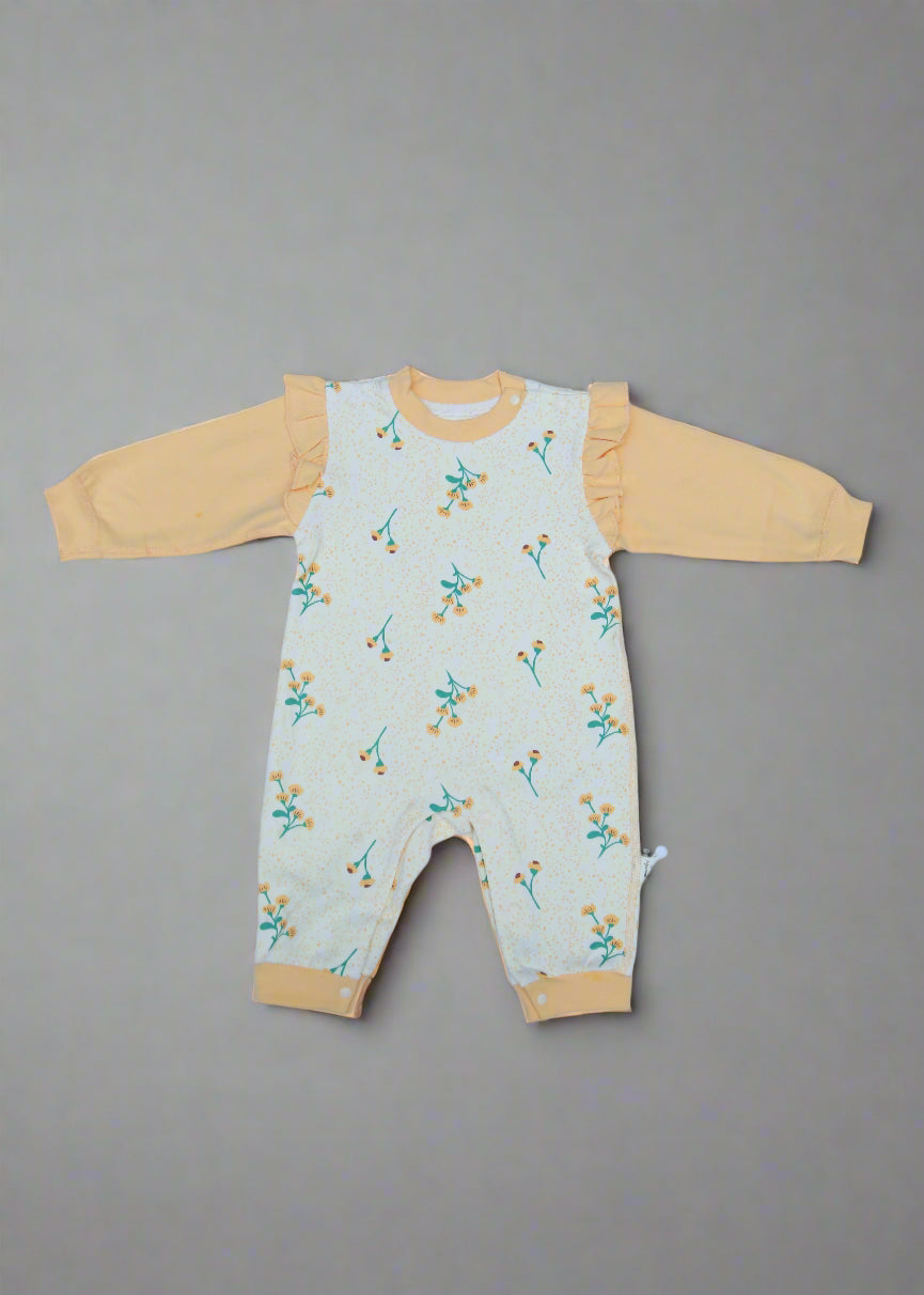 Baby romper with floral pattern on a gray background