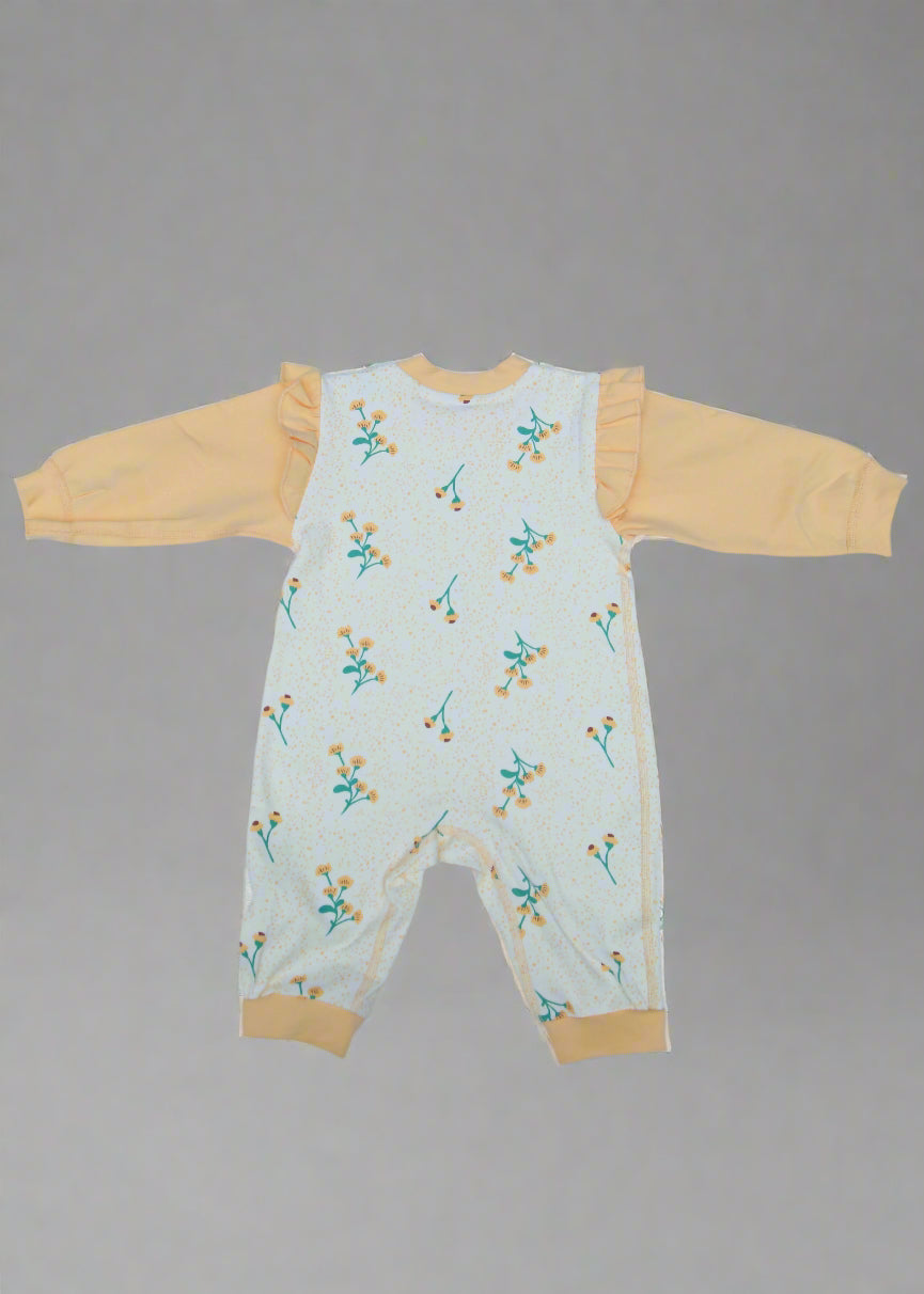 Children's outfit with floral pattern on a light blue background