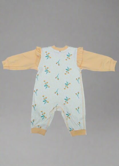 Children's outfit with floral pattern on a light blue background