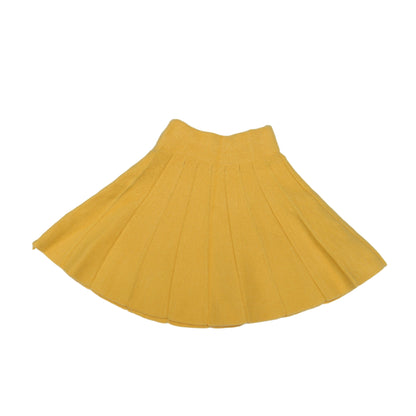 Yellow pleated skirt on a white background