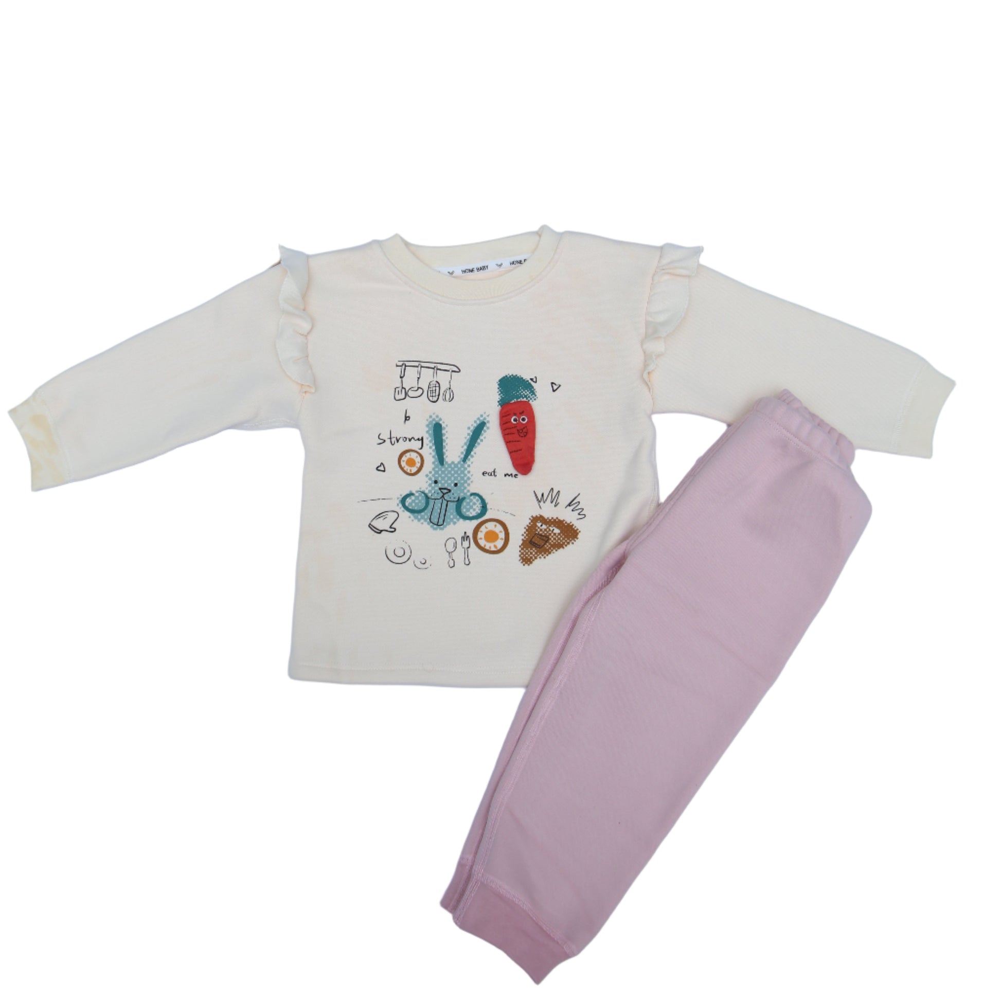 White shirt with cartoon design and pink pants on a light blue background