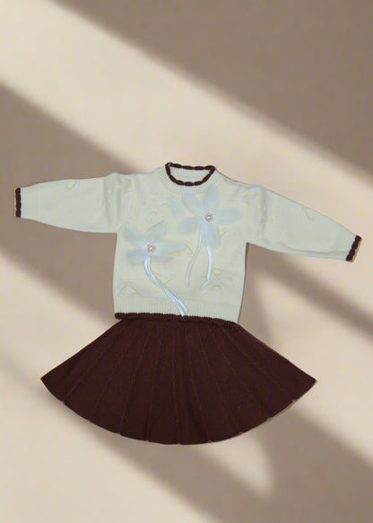 White garment with brown accents on a white