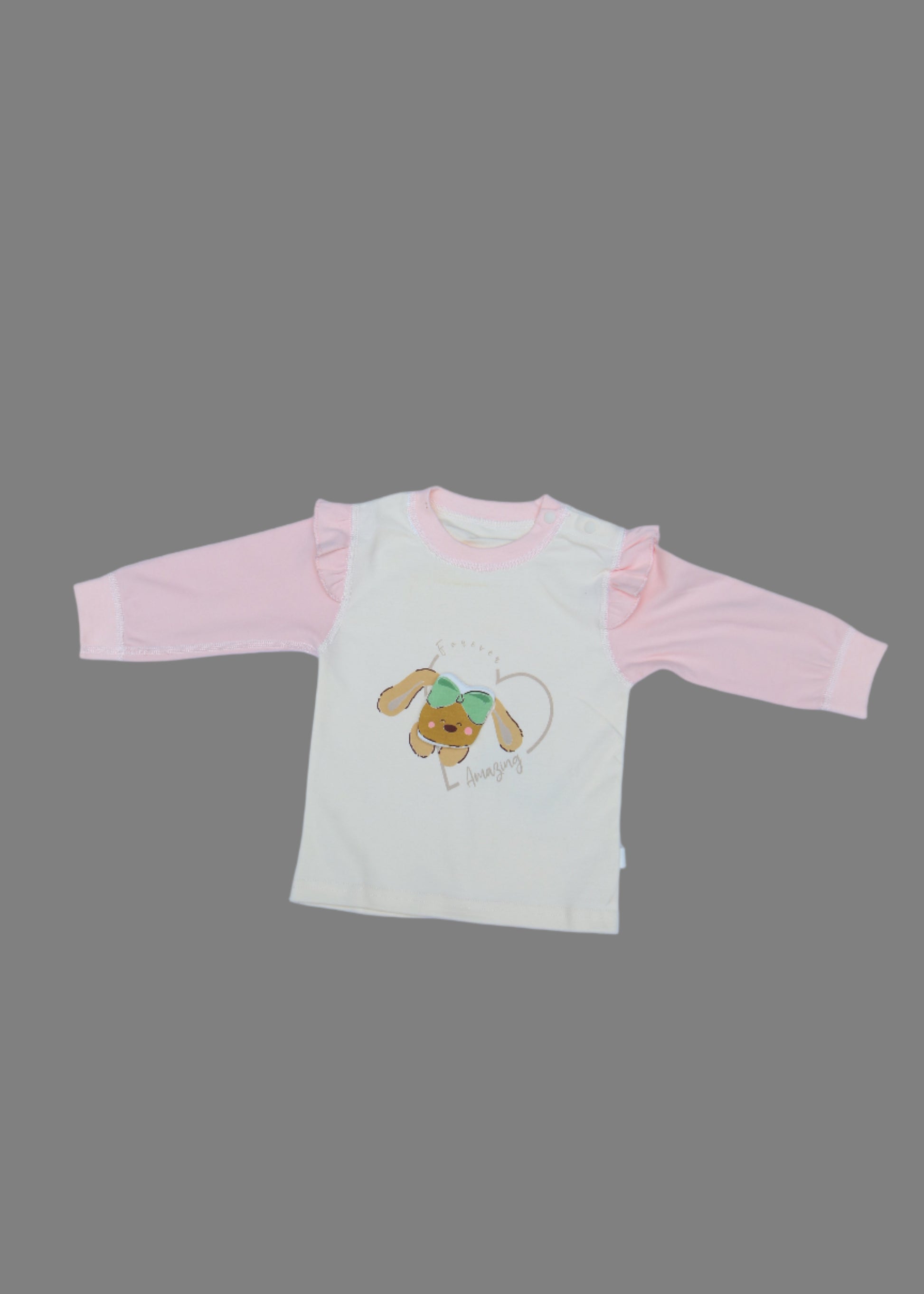Baby outfit with pink pants and embroidered bear design on a light blue surface.