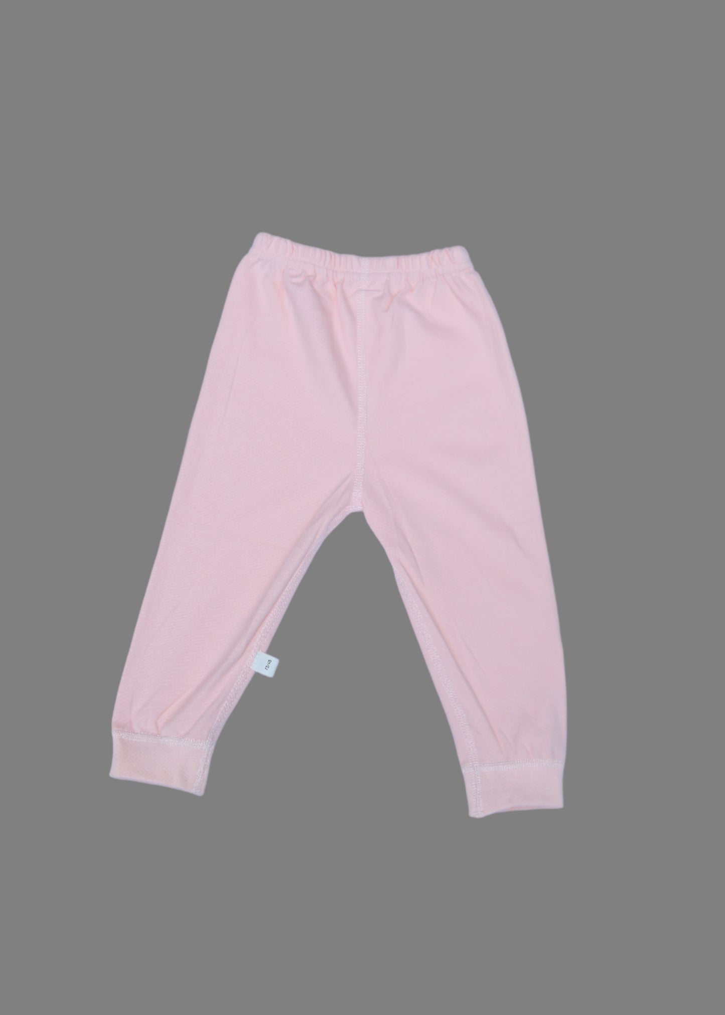 Pink baby pants on a light blue background
