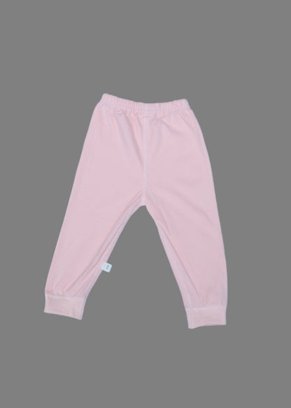 Pink baby pants on a light blue background