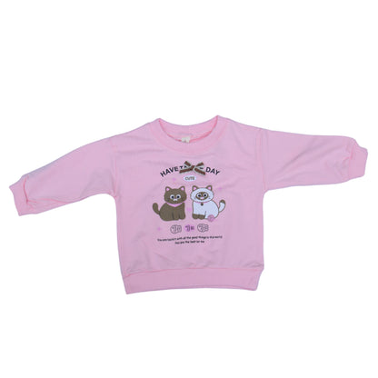 Pink baby outfit with cartoon design on a light blue surface