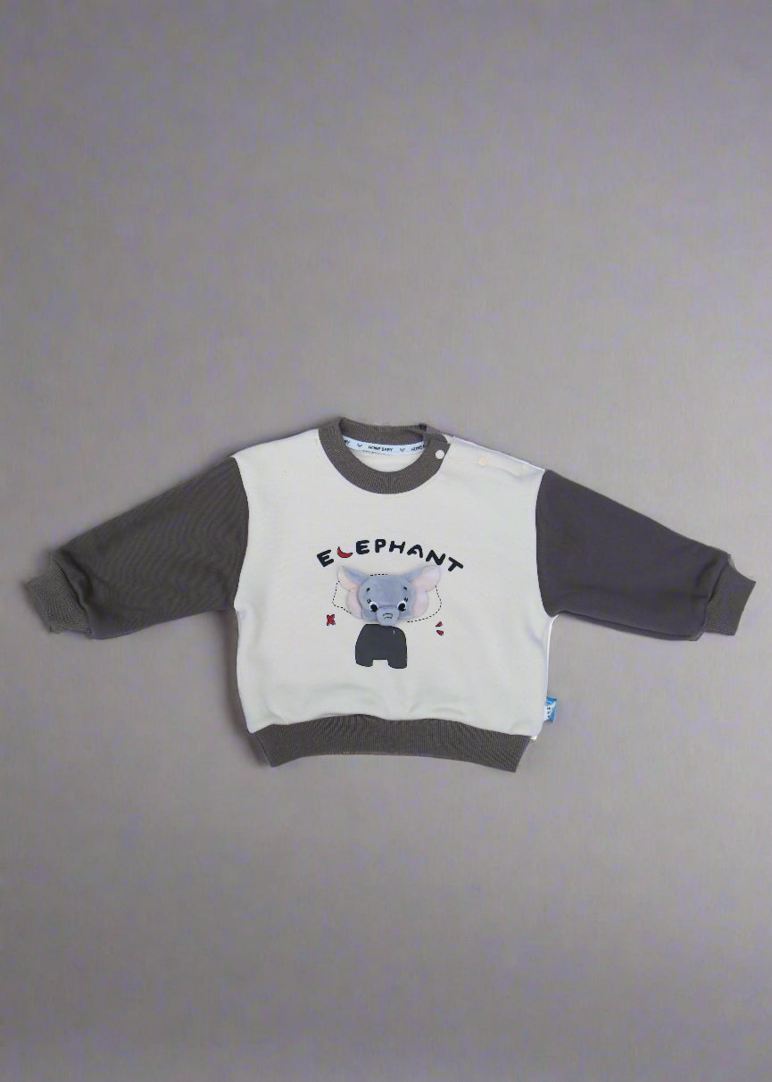 Children's outfit with a logo on a light blue surface