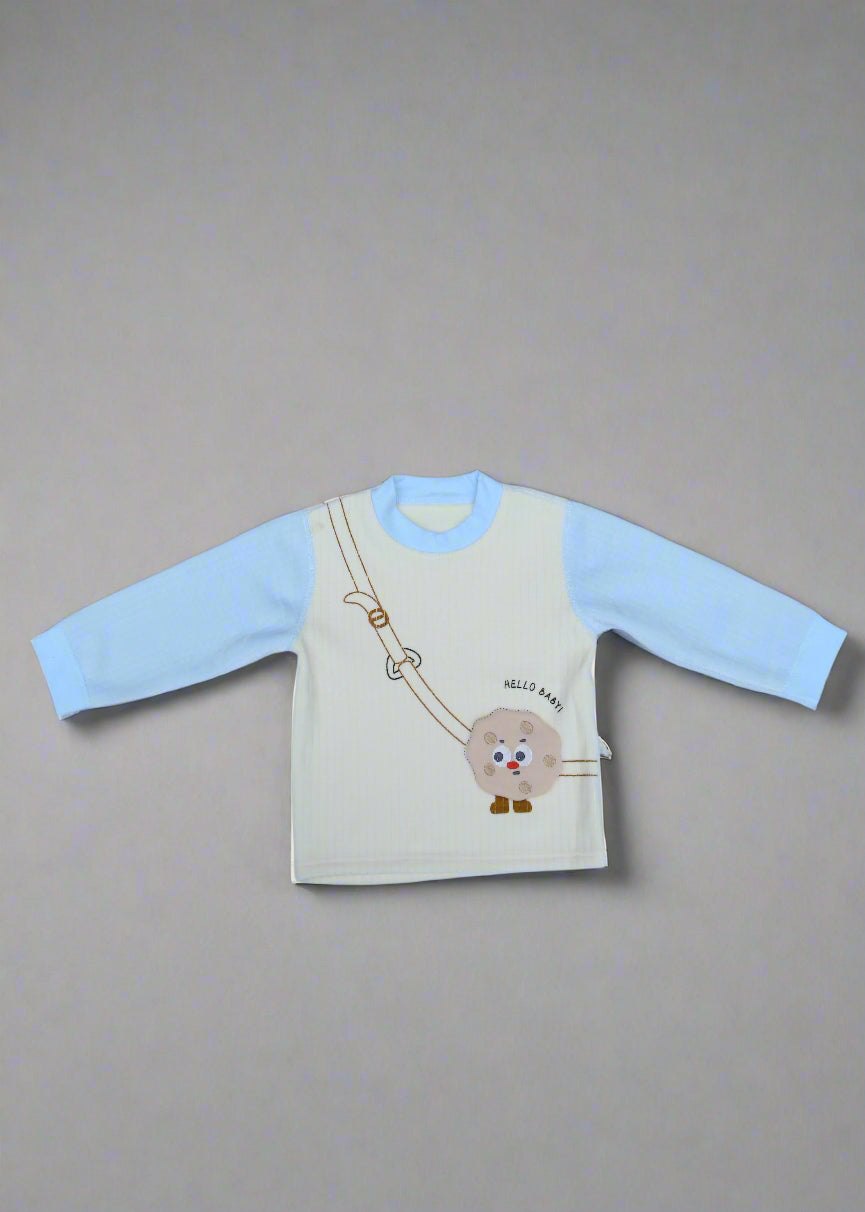 Children's shirt with cartoon design on a light blue background