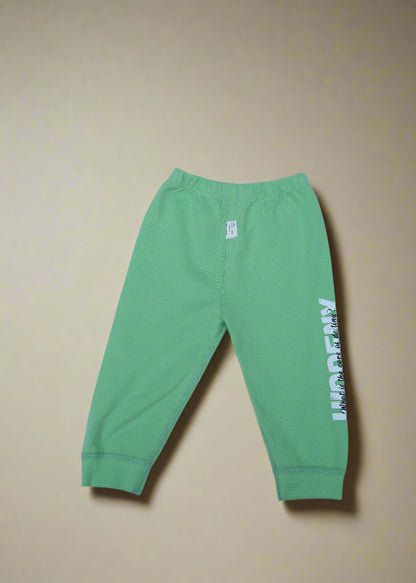 Green pants with text on a light blue background