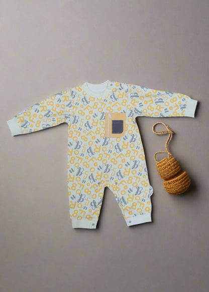 Yellow and gray patterned baby romper on a light blue background
