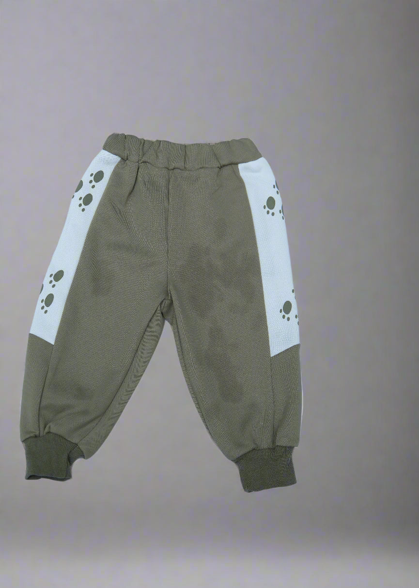 Brown pants with paw print design on a light blue background