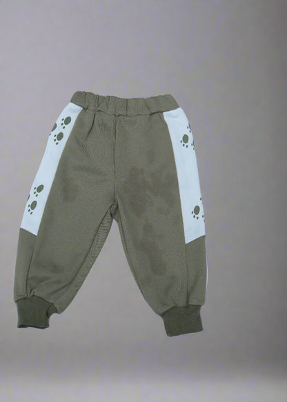 Brown pants with paw print design on a light blue background