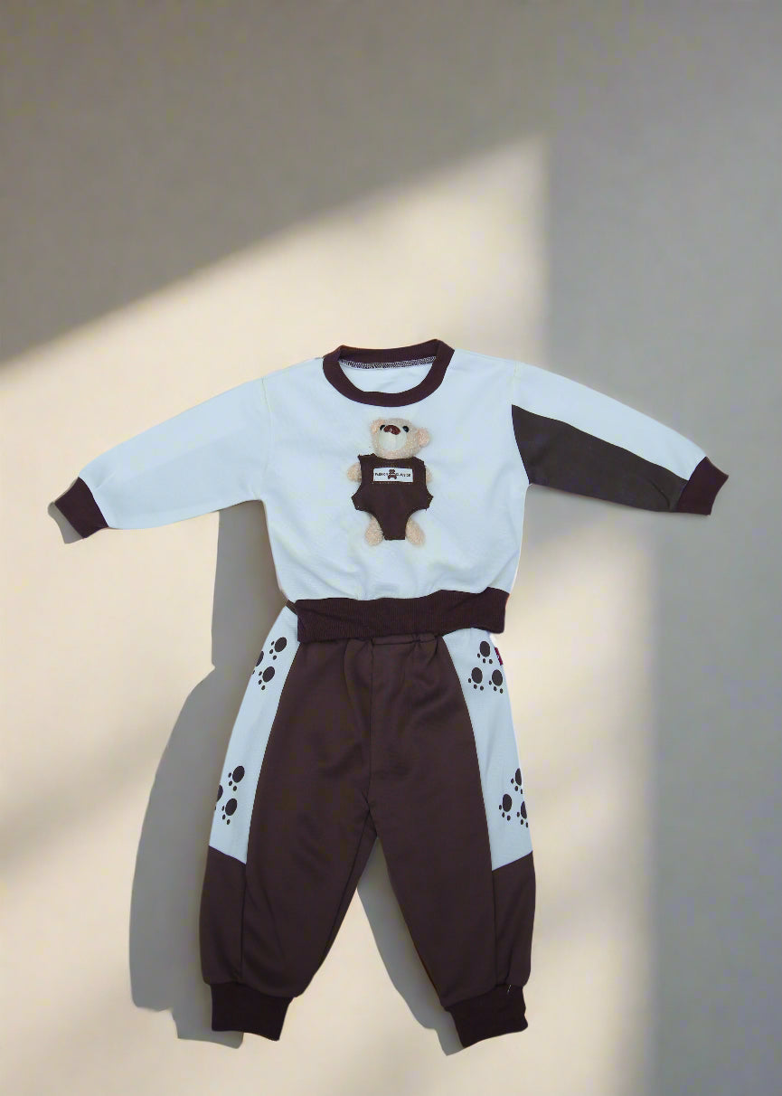 Children's brown and white outfit on a white sheet