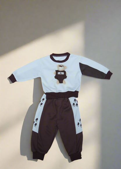 Children's brown and white outfit on a white sheet