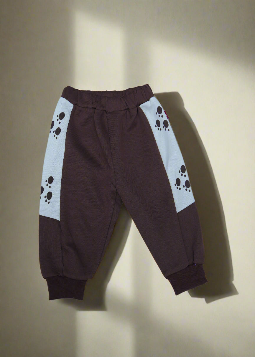 Brown pants with paw print design on a light blue background