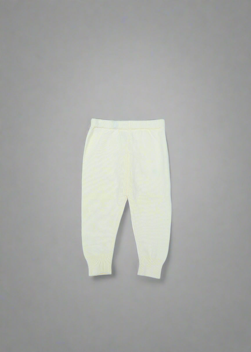 White shirt with a yellow patch on a light blue background