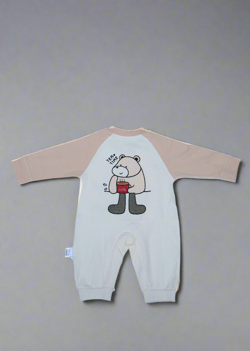 Beige long-sleeve shirt with cartoon design on a light blue background