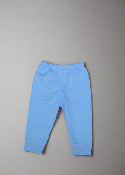 Light blue baby pants on a light gray background