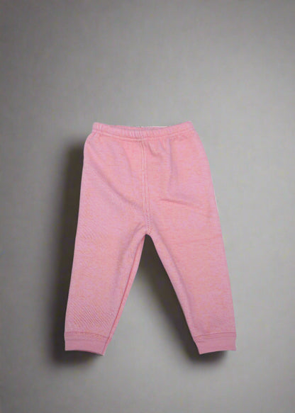Pink baby pants on a light blue background