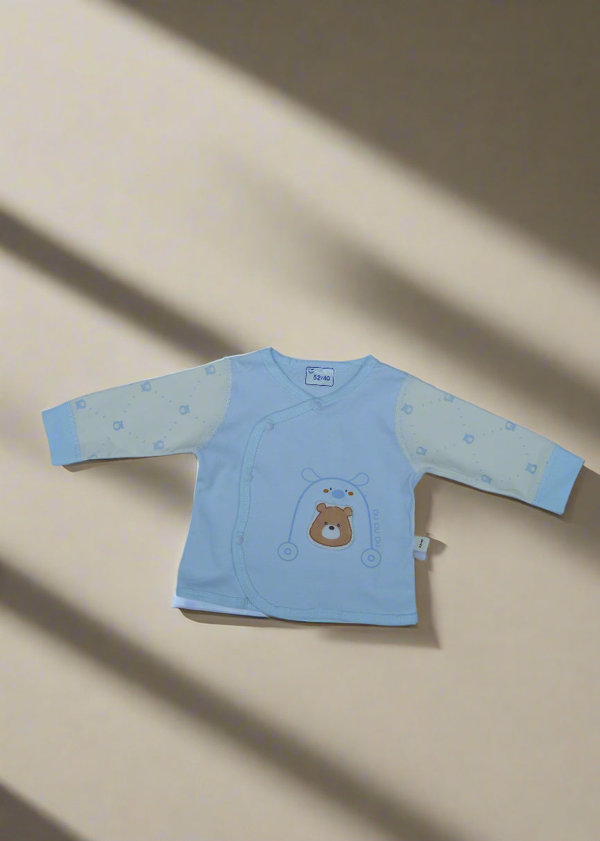 Light blue baby outfit with bear design on a white background