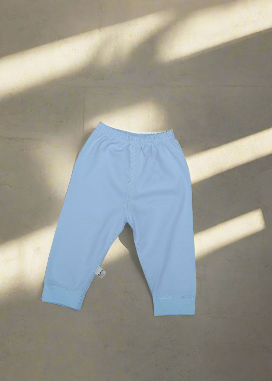 Light blue long-sleeve shirt on a light gray background