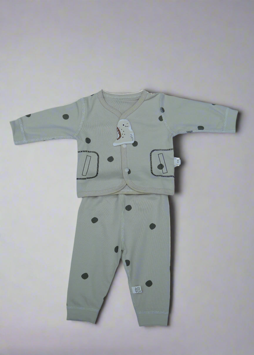 Children's outfit with long-sleeve top and pants on a light blue background