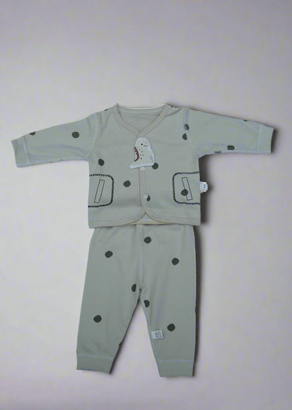 Children's outfit with long-sleeve top and pants on a light blue background