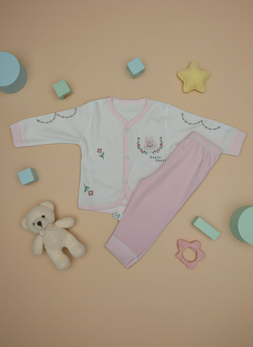 Set of pink and white children's underwear on a light blue background