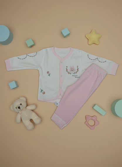 Set of pink and white children's underwear on a light blue background