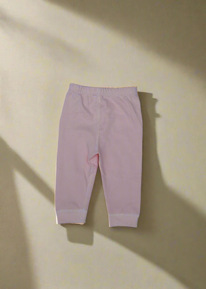 Pink leggings on a light blue background