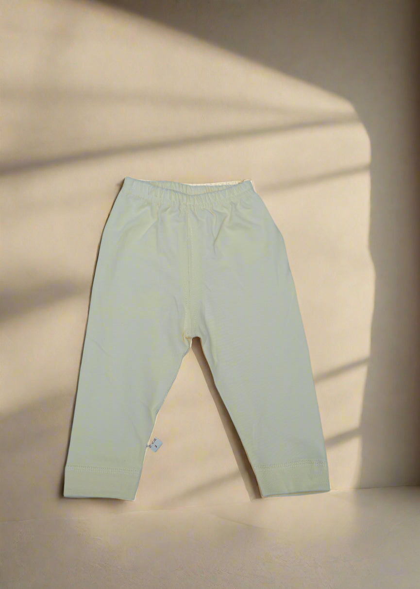 Light-colored pants on a light blue background