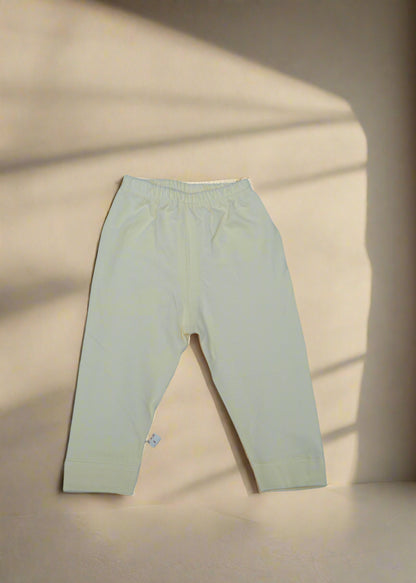 Light-colored pants on a light blue background